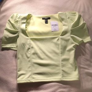 cropped blouse with puffed sleeves.